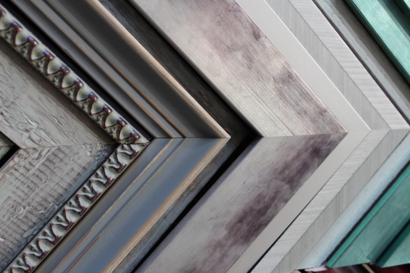 Close detail of ornate metallic frame moulding
